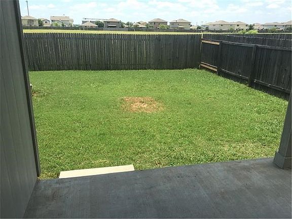 Covered patio and view of yard
