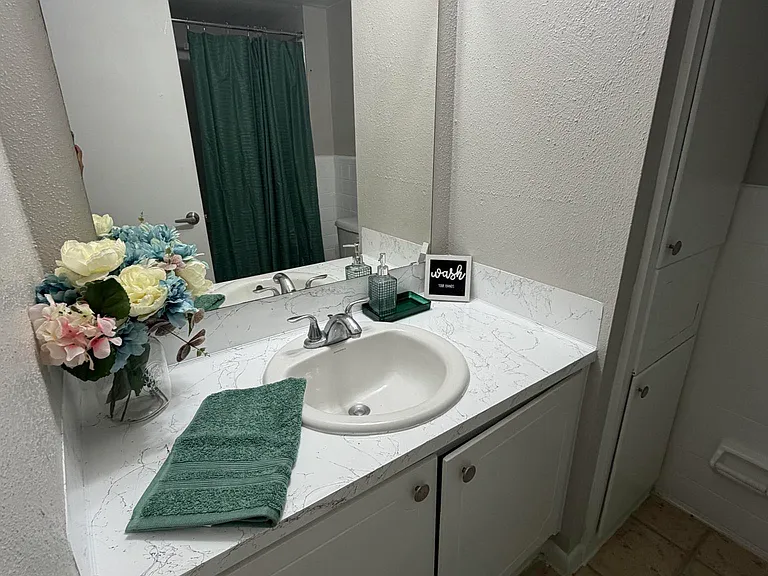 Spacious bathroom with closet storage!
