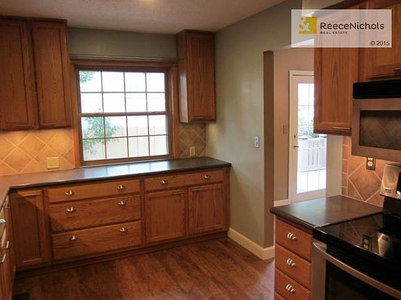 Kitchen with view of Patio.  Entry to dining area just to the ri
