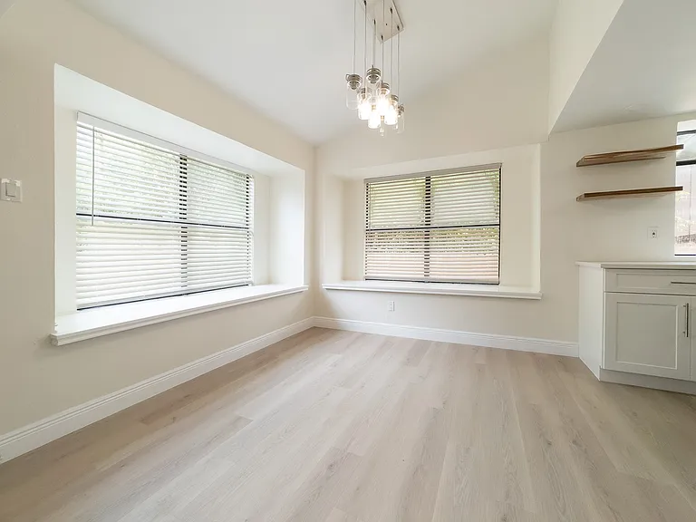 Breakfast nook style windows in dining room area.