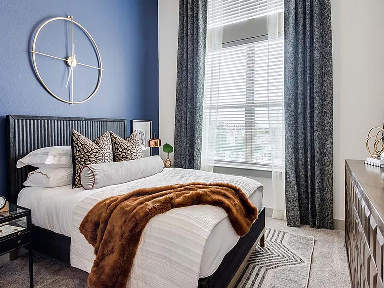 Griffis Frisco apartment bedroom with plush carpet.
