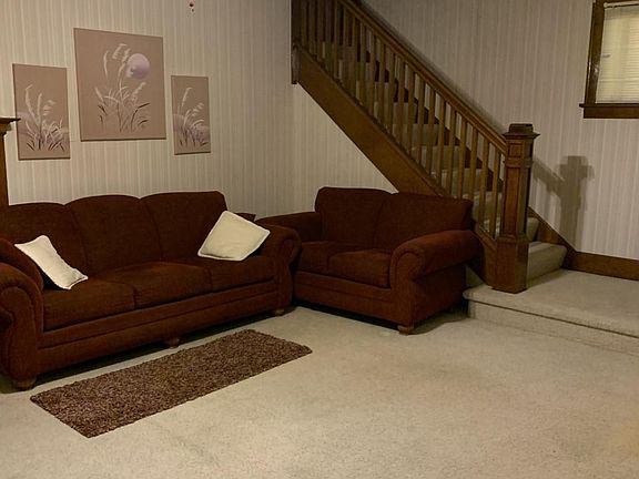 Living room, stairs to locked upstairs apartment door