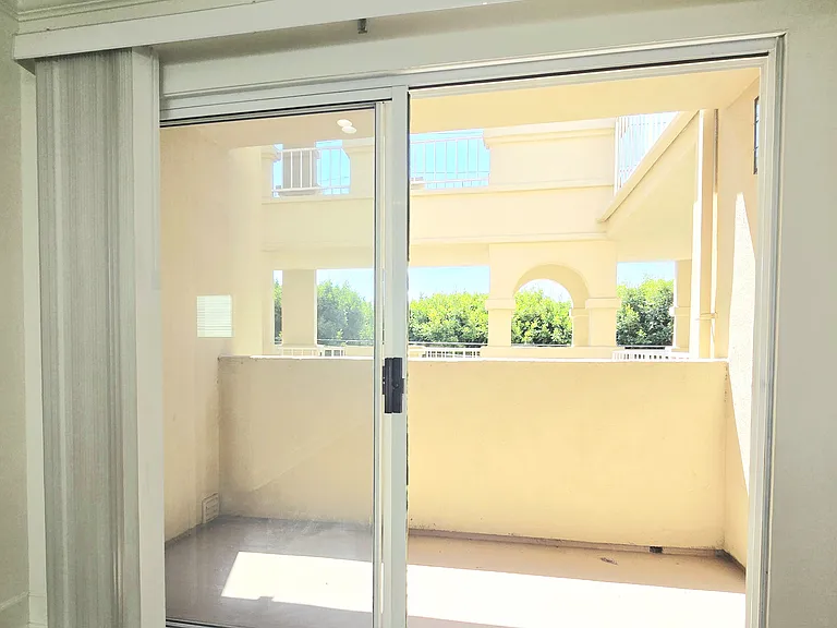 Sliding Doors off the living room to an Open Balcony