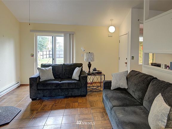 Cozy living room with free standing fireplace.