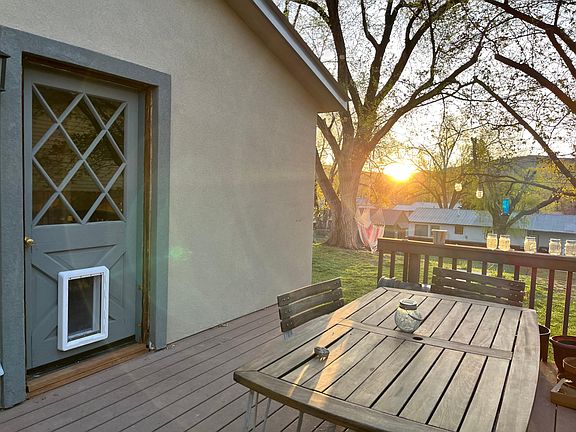 Side door to the backyard, door to master bathroom, pantry shelving
