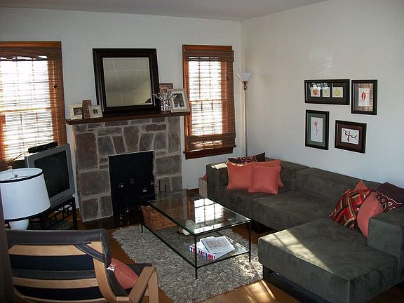 View of the living room as you enter from the front door, original wood floors