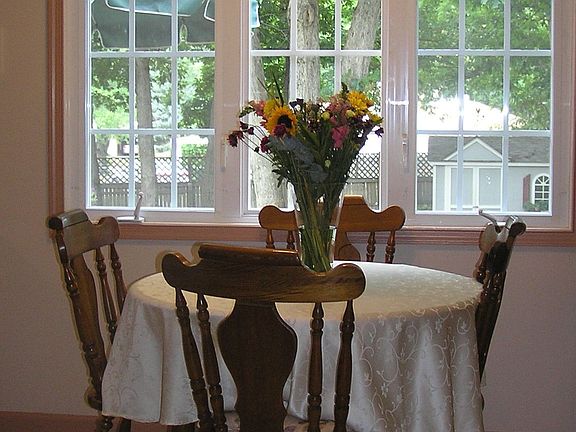 Eat-in kitchen with beautiful park-like view!