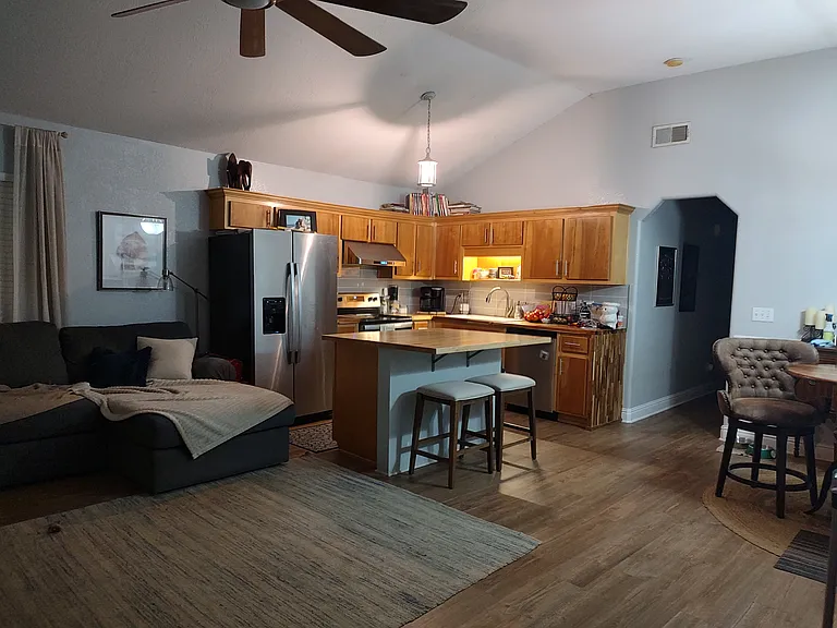 Open concept living/dining/kitchen with vaulted ceilings, perfect for entertaining and keeping everyone in the heart of the house!