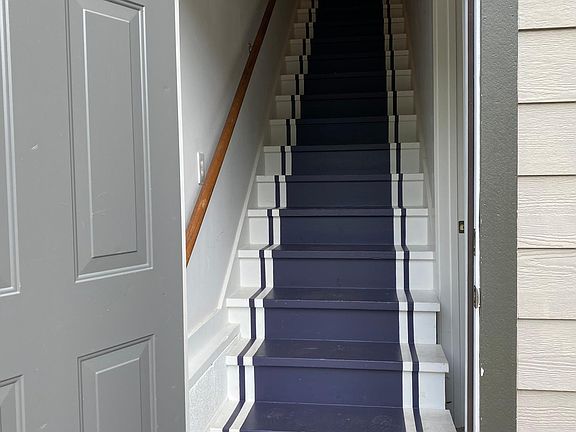 Enclosed private stairs leading to apt