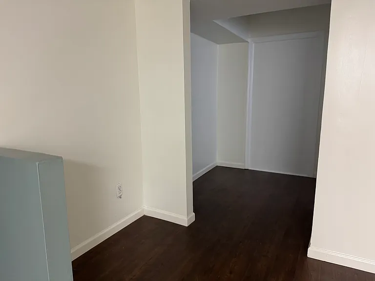 Office nook in living room, near laundry.