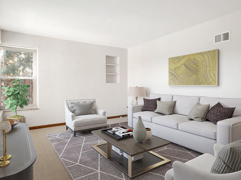 Spacious living room overlooking a tranquil courtyard with stunning landscape. Newly replaced carpet.
