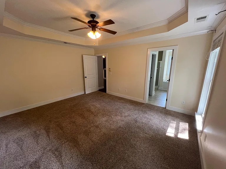Spacious mater bedroom with trey ceiling