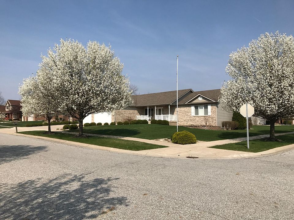 Distant view of house with flag pole