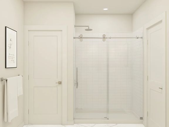 Primary bath with glass shower enclosure