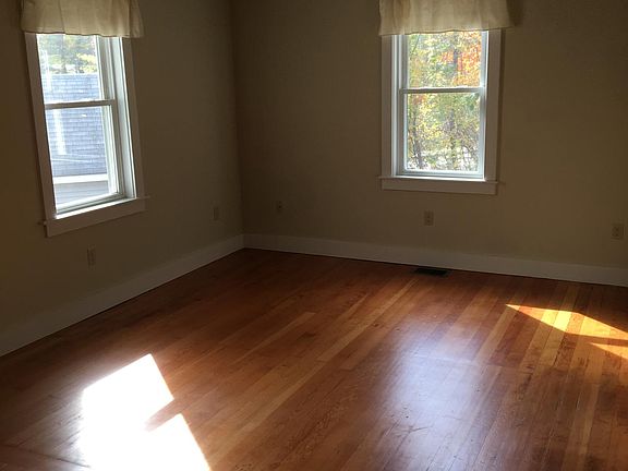 Living room has ceiling fan, recessed adjustable lighting and is cable ready.