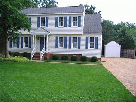 Front with manicured lawn