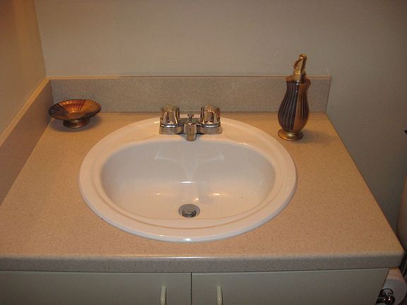 Bathrooms w/Corian Countertop