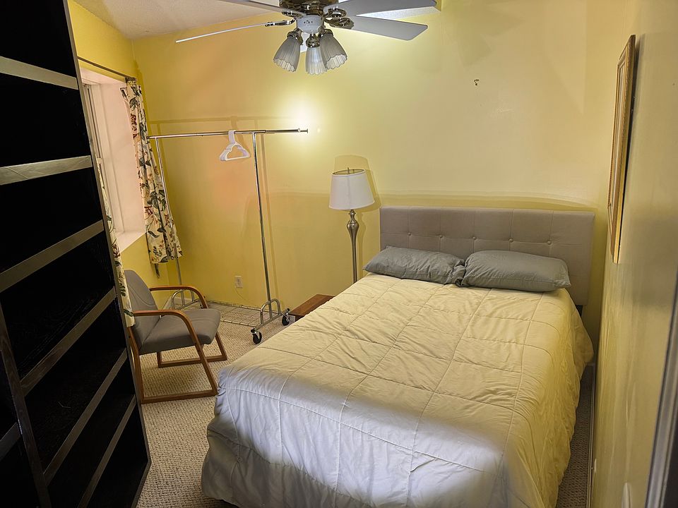 The smaller bedroom has a twin mattress, comfy chair, hang up area and a great deal of shelving