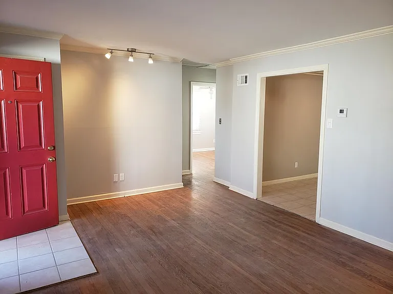 Another angle of the living room showing the double entry way to the dining.