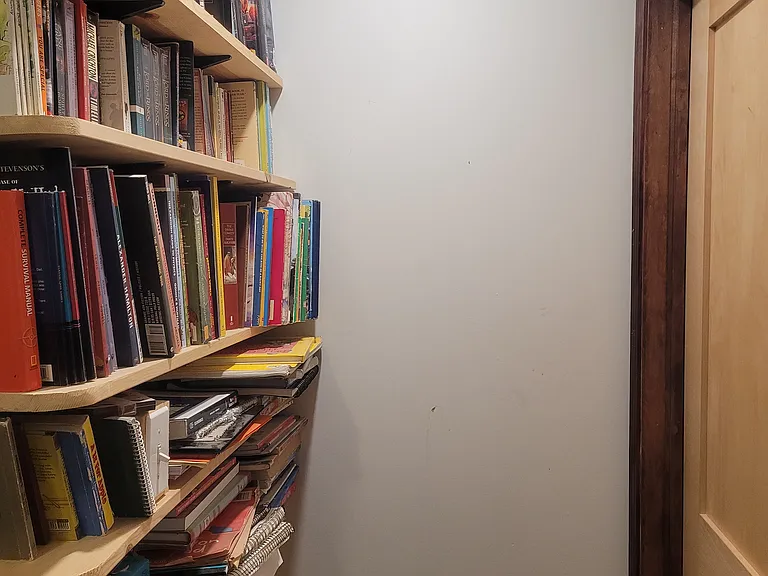 bookcase in upstairs hallway