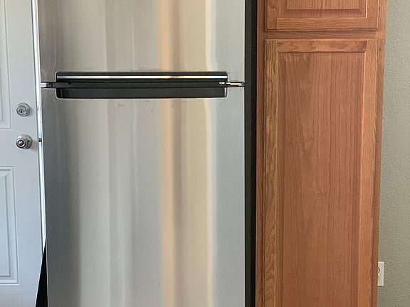 Brand new refrigerator and cabinet