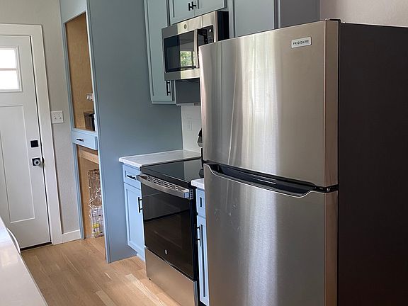 Other side of Kitchen room for full size stackable washer & dryer
