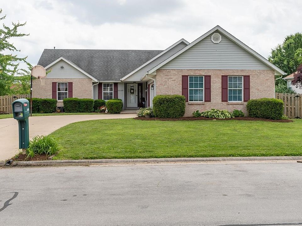 Playing basketball in the large driveway is a breeze! Look at the beautifully manicured lawn and landscaping.