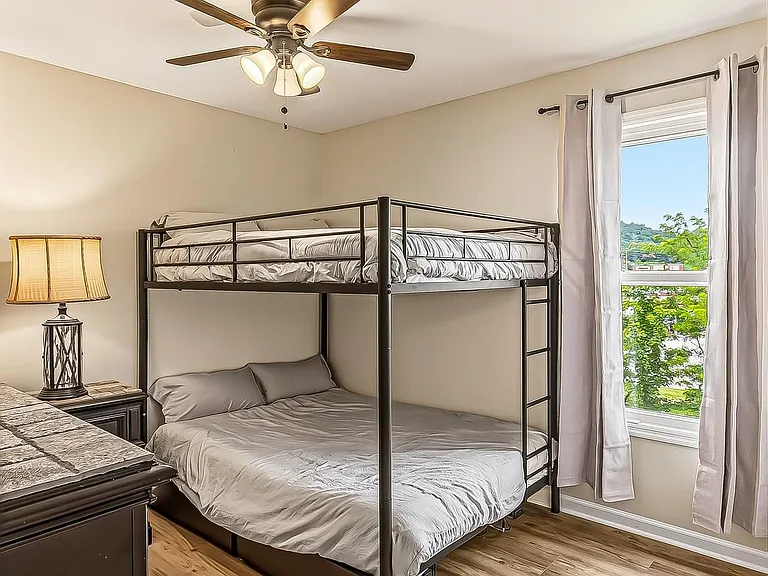 Two full-sized beds on a bunk bed