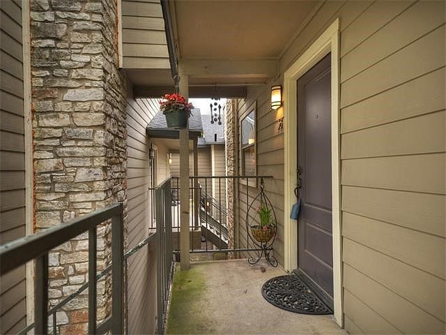 Enter from your semi-private, covered balcony, shared with only one neighbor.