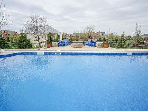 Huge Pool, fire pit, & professional landscaping including cherry trees, apple trees and area for garden