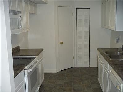 Nice kitchen with plenty of cabinet&counter space with pass through window to the living room.