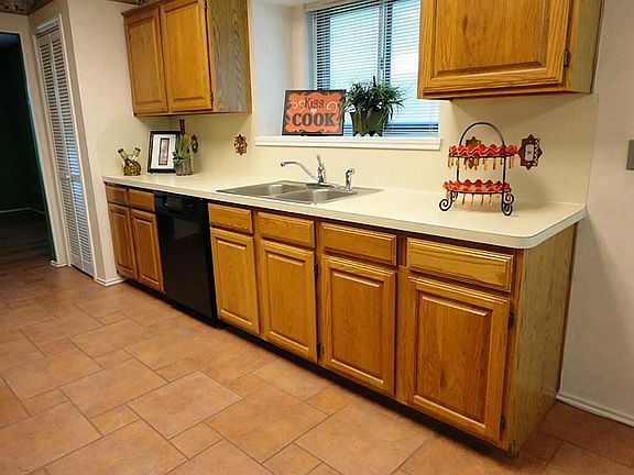 Garden window above the stainless sink.  Built in wine rack above refrigerator!