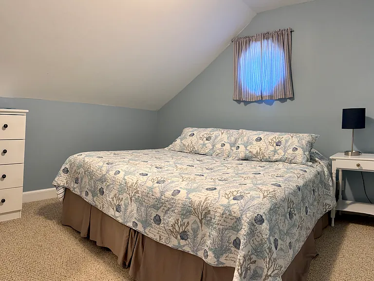 2nd floor bedroom with the two twin beds pushed together to create a king size bed.