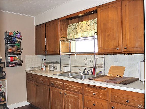 Great storage space for your kitchen gadgets. Nice size window for morning light. This home is ready for you