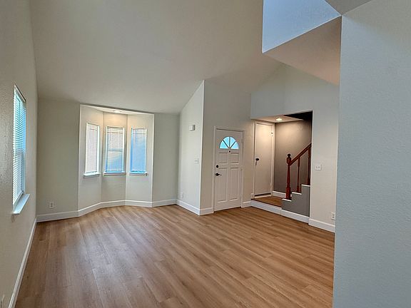 Large living room with lots of natural light
