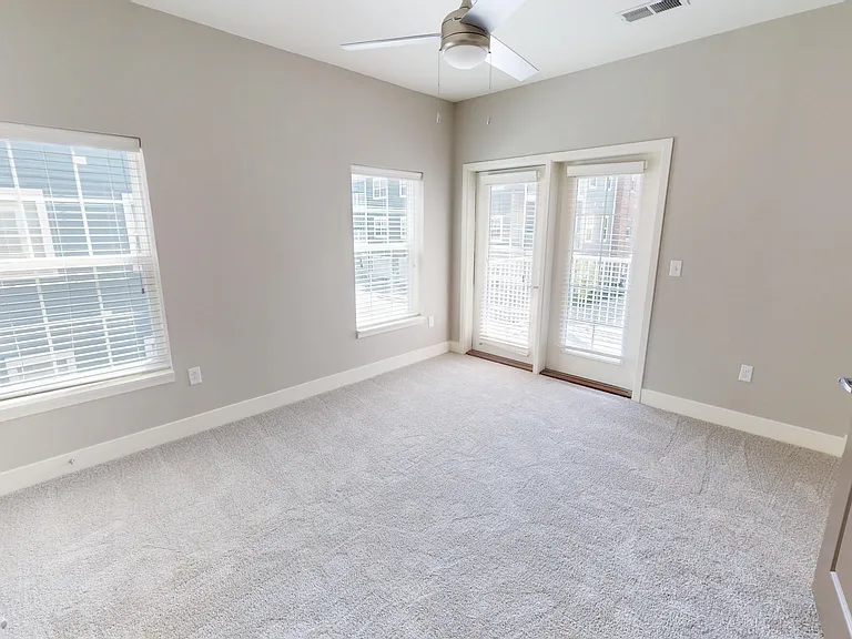 The Presley floor plan's primary bedroom features lots of natural light and a door to the private patio or balcony. The Presley floor plan's primary bedroom features lots of natural light and a door to the private patio or balcony.