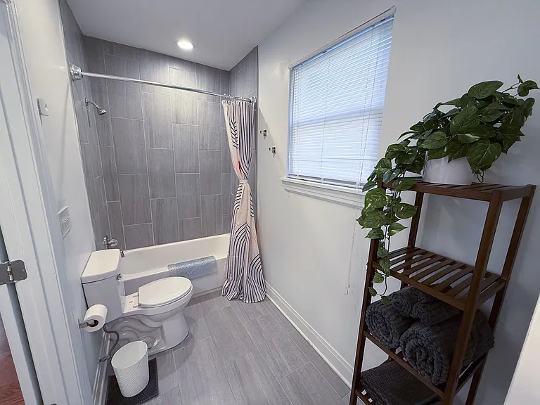 Large full bath with tub/shower combo.