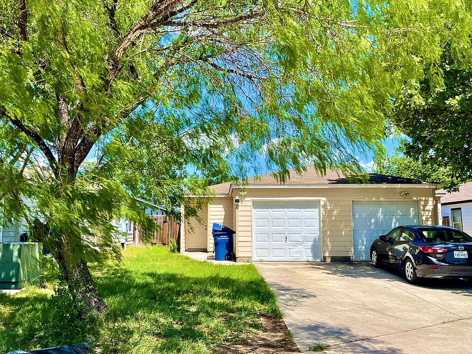 Driveway and garage with entrance on the left