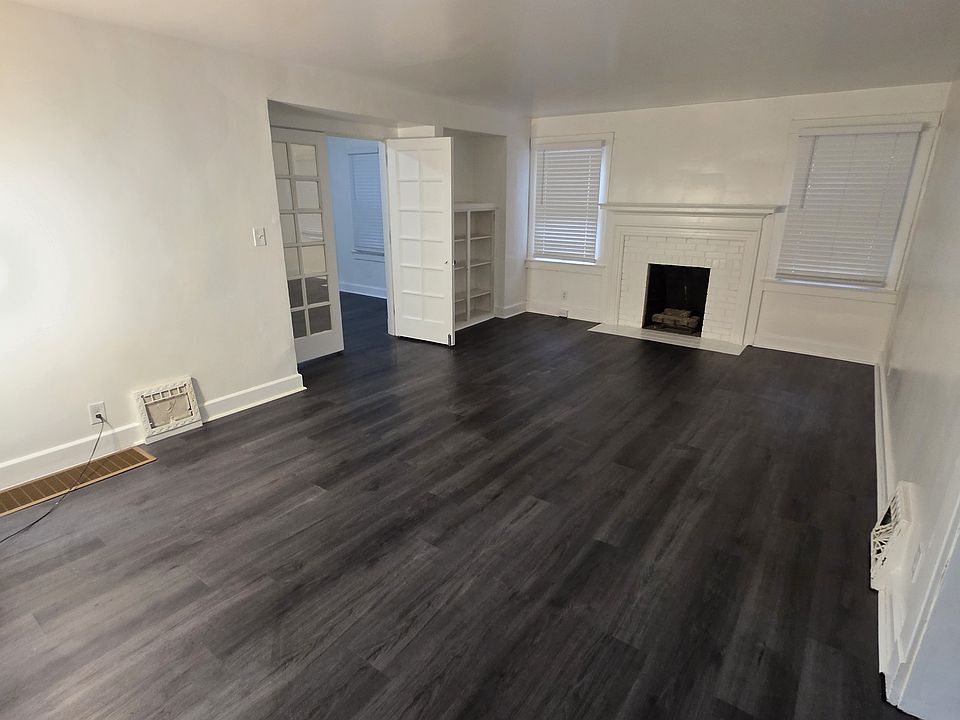 Living room with fireplace and built in bookcase