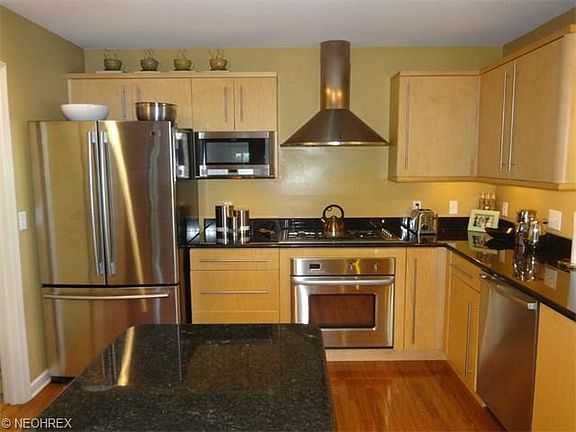 Eat- in Kitchen with granite counte tops and hardwood floors