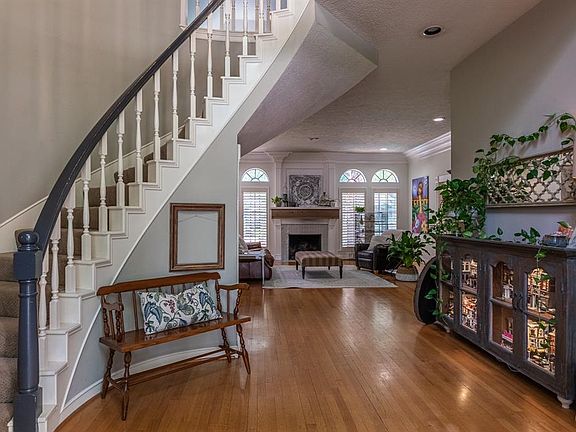 With a 2 story entry and soaring staircase you are greeted with the warmth of the real wood floors and beautiful natural light coming thru the large windows of the living room.