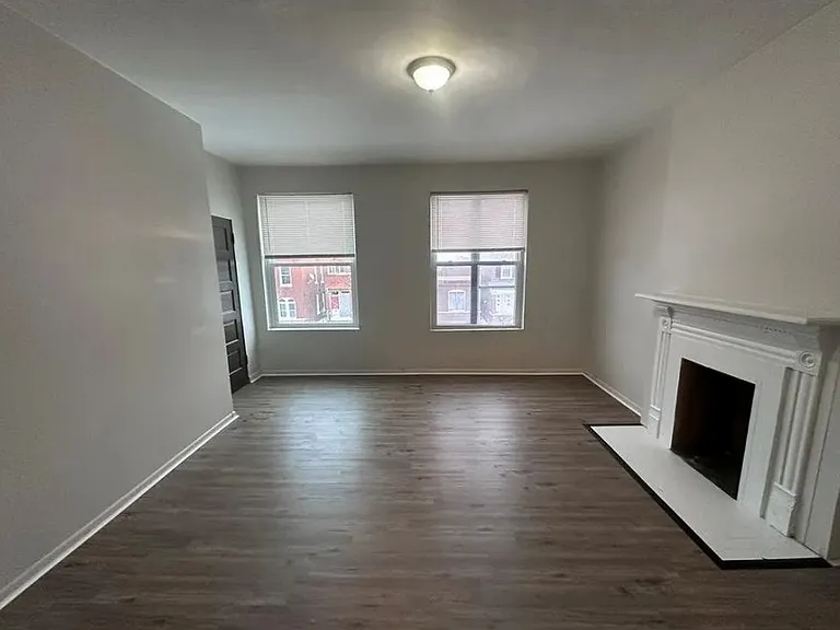 Spacious living room with updated flooring throughout