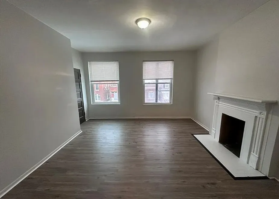 Spacious living room with updated flooring throughout