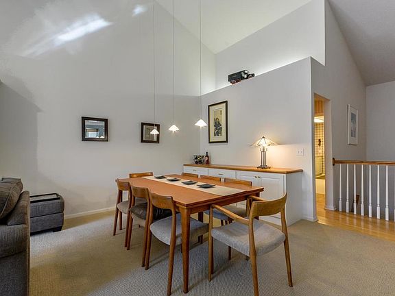 The dining room area is large and can accommodate a large hutch, table and chairs.  On the backside is built-in cabinetry.