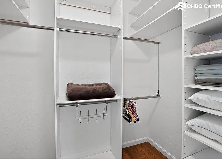 The upper level guest bedroom walk-in closet is huge