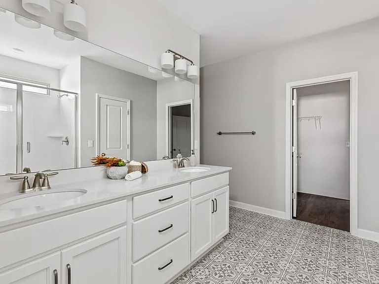 Master bathroom with two linen closets, toilet room, and master walk-in closet
