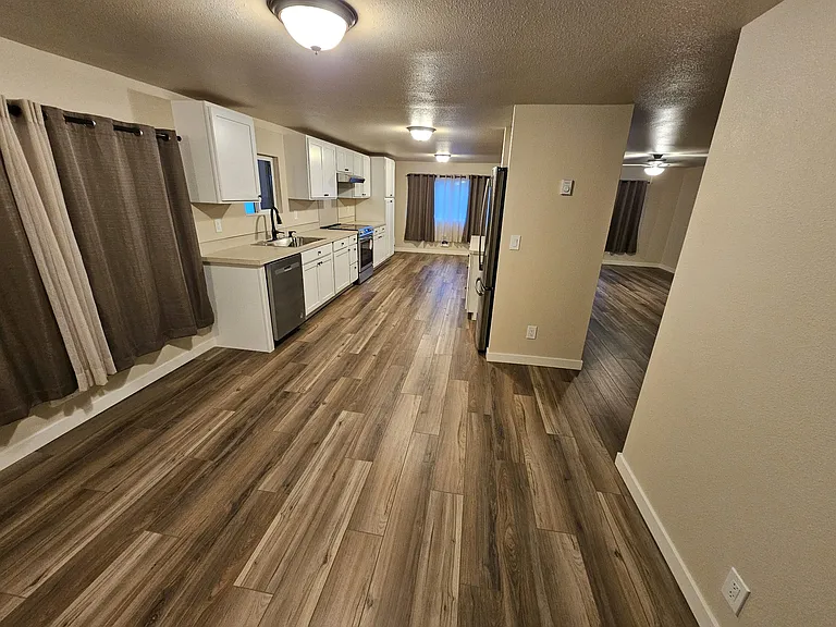 Unfurnished informal dining area, kitchen, and formal dining areas