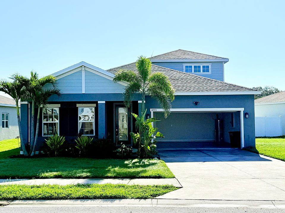 Street view of the home's exterior and front elevation.