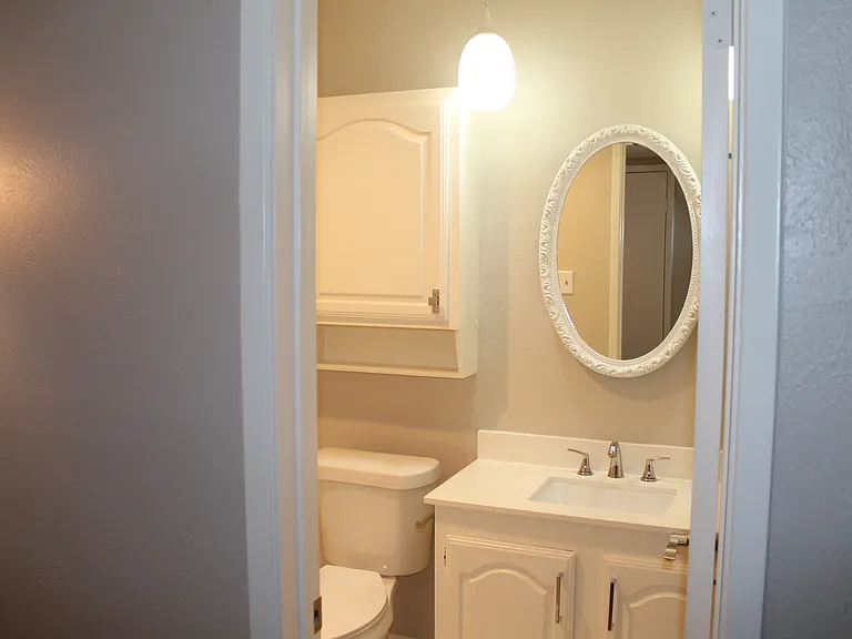 Hallway full bathroom featuring a tub/shower combination and generous storage cabinetry