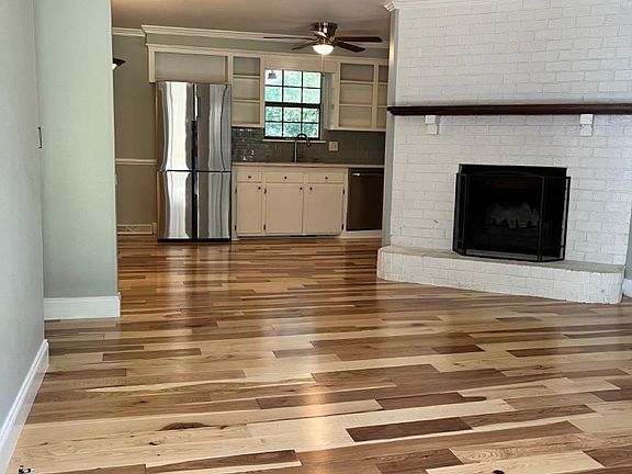 Upon entering ... brand-new hickory floors! Please note that the ceiling fans have been upgraded from these pictures